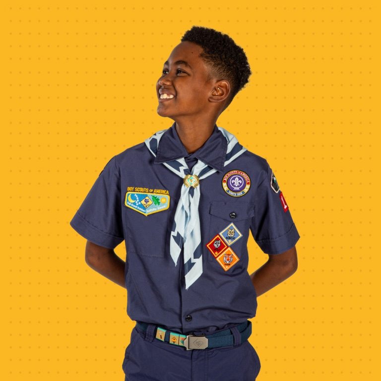 Cub Scout wearing the blue Cub Scout uniform